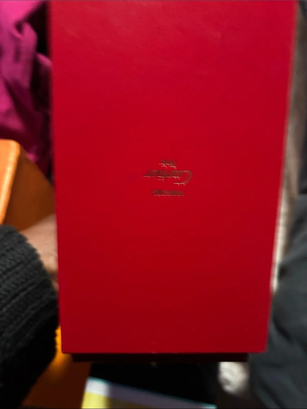 Cartier red and gold jewelry box with decorative trim/L.A.M.B fr by Gwen Stefani